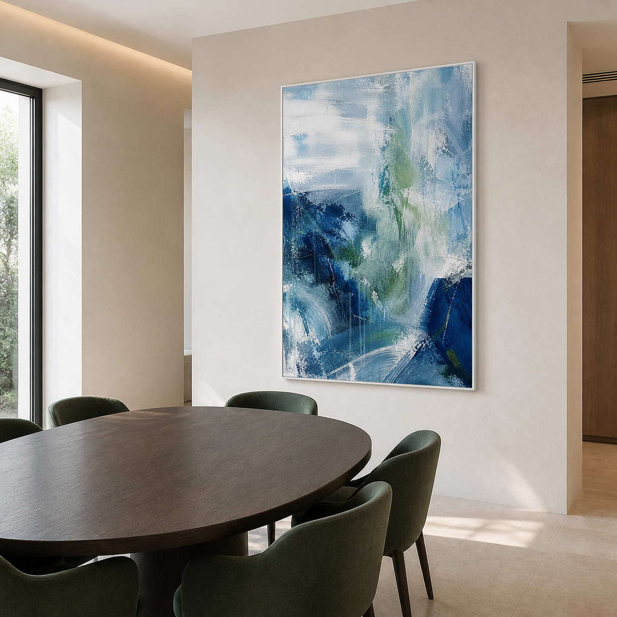 Cool blue abstract artwork above a contemporary round dining table.