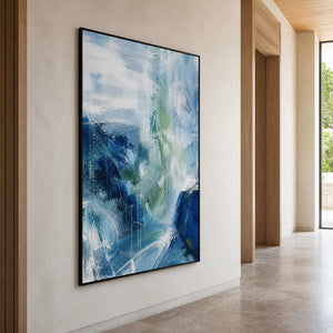 Tall blue abstract painting bringing depth to a quiet hallway.