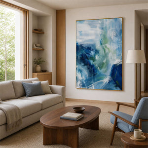 Blue and sage textured abstract wall art in a light modern living room.