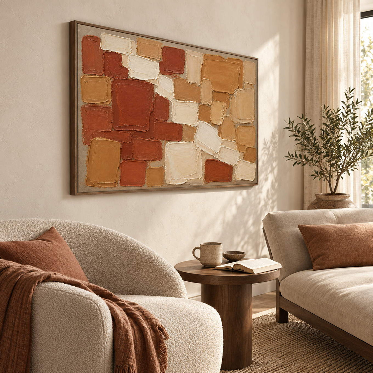 Terracotta, ochre, and cream raised block painting in a brown wood frame in a lounge.