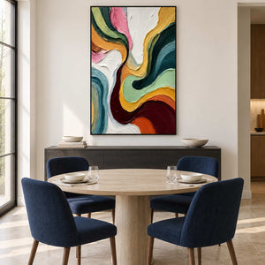 Flowing-color artwork behind a round table and navy dining chairs.