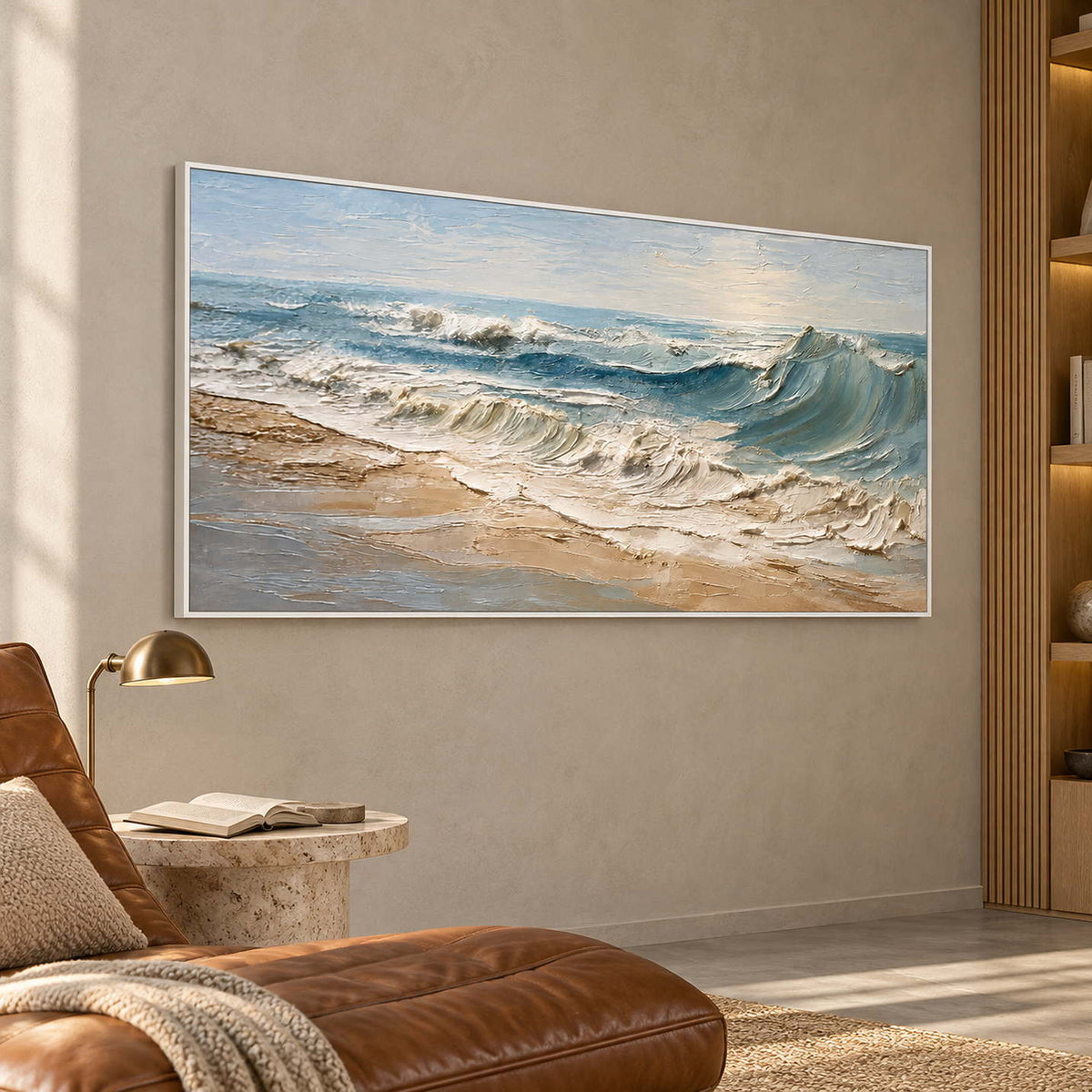 Pale wave seascape beside a brown chaise and a small reading lamp.