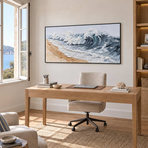 A Letter from the Waves in a black frame above a light wood desk beside an open window.