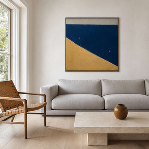 Modern geometric wall art in a serene Hampton living room