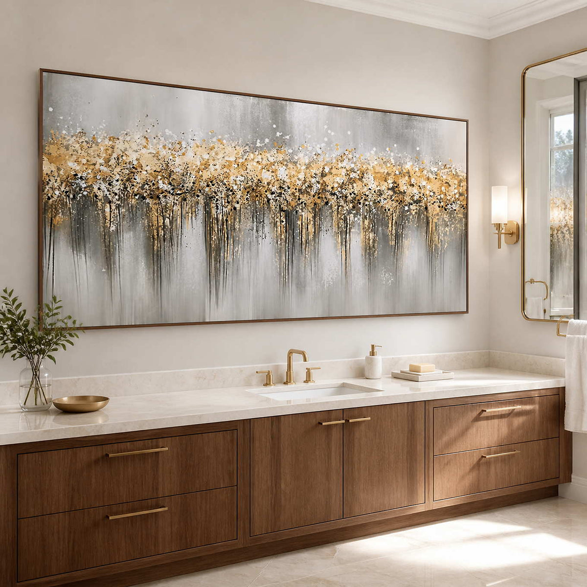 Wood framed gold and gray artwork above a bathroom vanity beside a wall mirror.