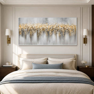 White framed panoramic abstract painting above a cream bed with blue gray accents.