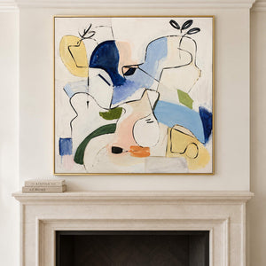 Loose black outlines and blue, yellow and green abstract shapes in a gold frame, displayed above a fireplace.