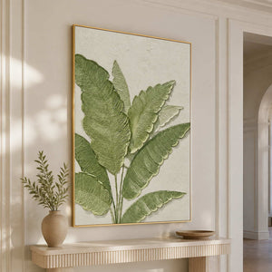 Gold-framed botanical wall art above a floating console in a light-filled hallway.