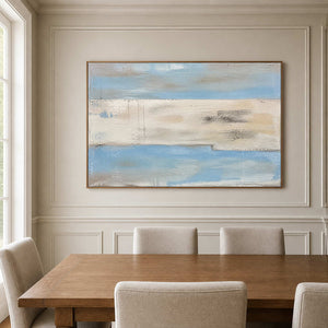 Minimalist blue and ivory wall art brings calm light to a modern dining room.