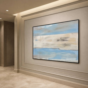 Horizontal blue and ivory coastal wall art along an elegant hallway.