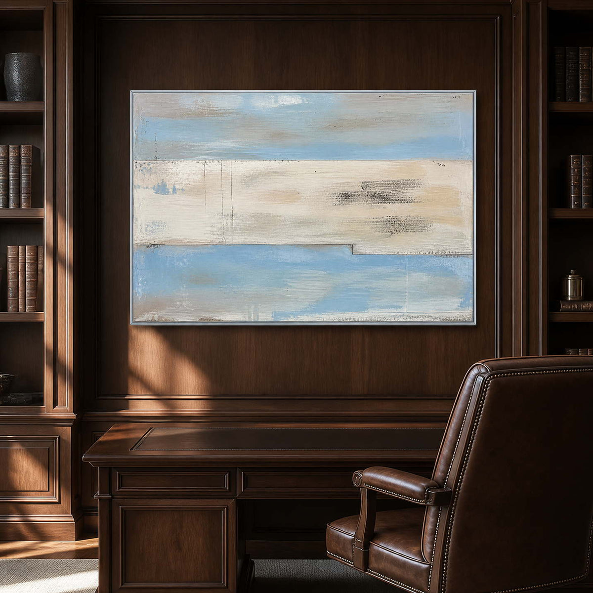 Pale blue minimalist painting displayed in a refined dark wood office.
