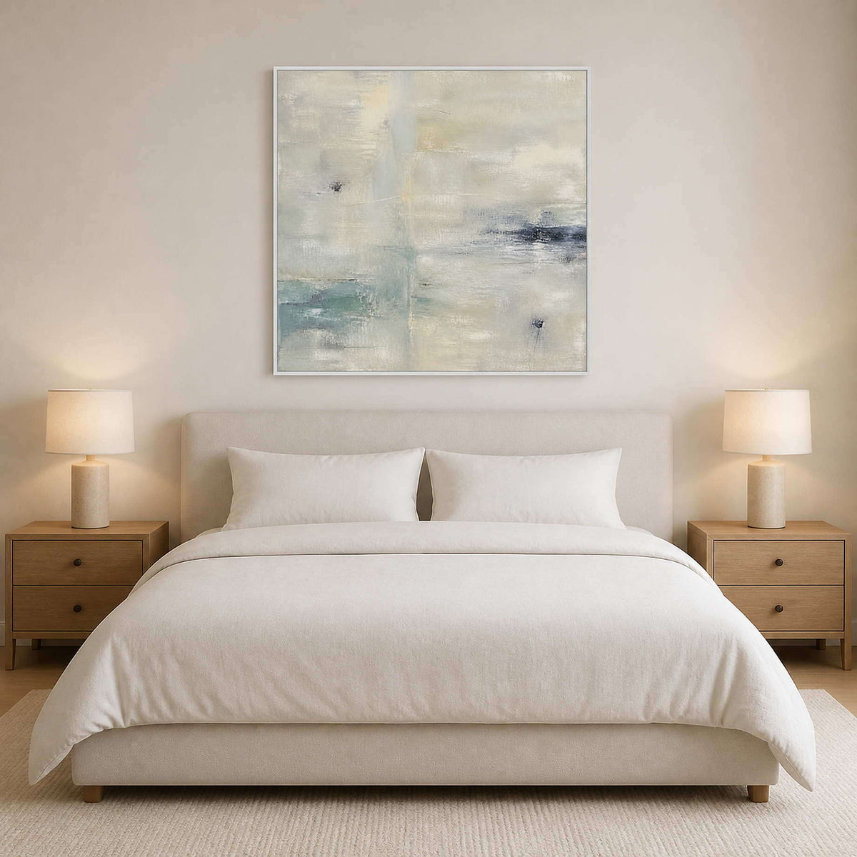 Calm neutral square artwork displayed above a light modern bed.