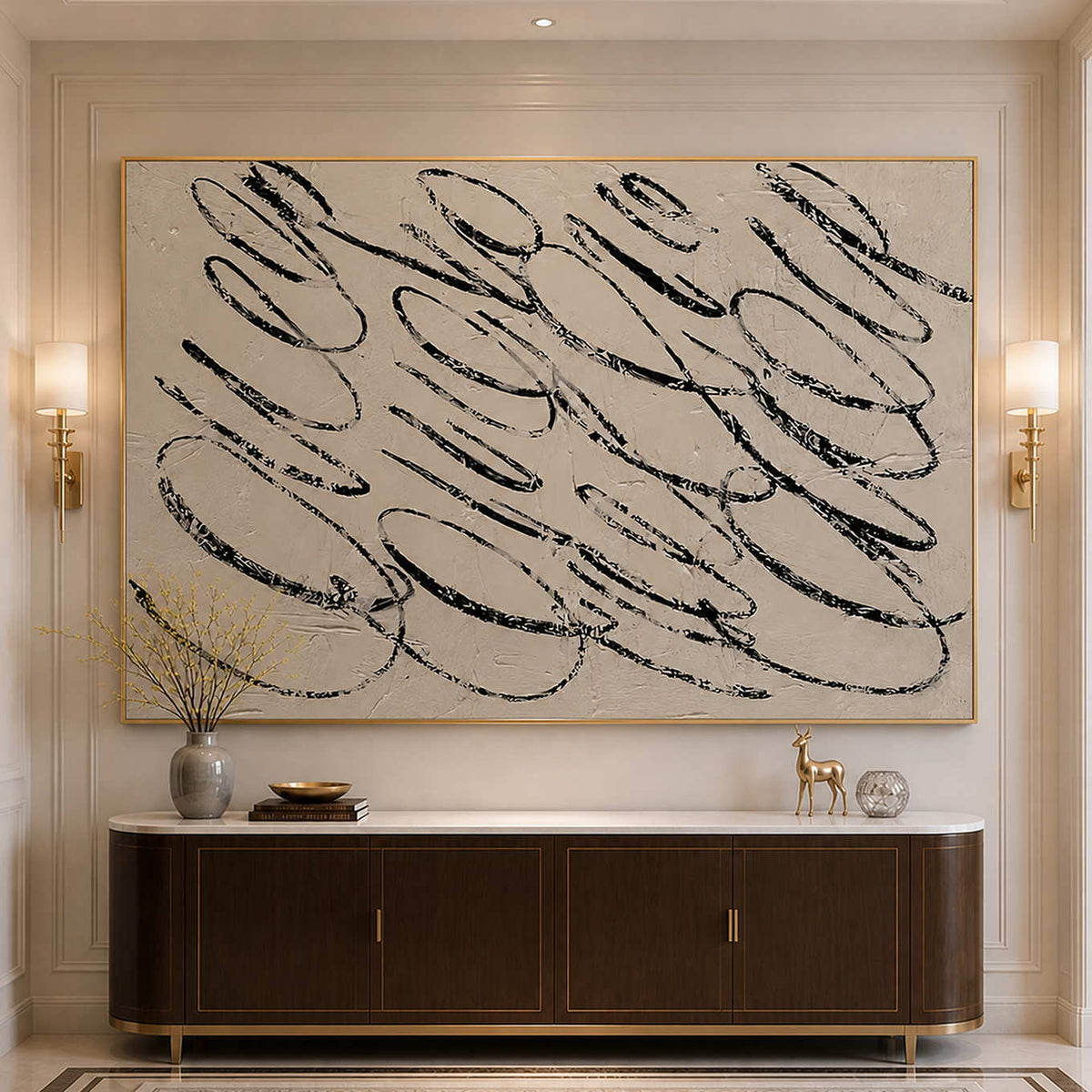 Gold framed looping abstract painting above a dark hallway console between sconces.