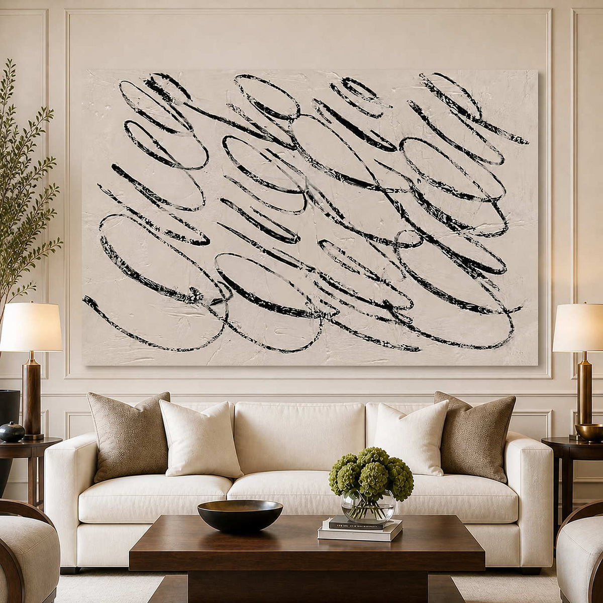 Frameless black looping abstract wall art above a cream living room sofa.