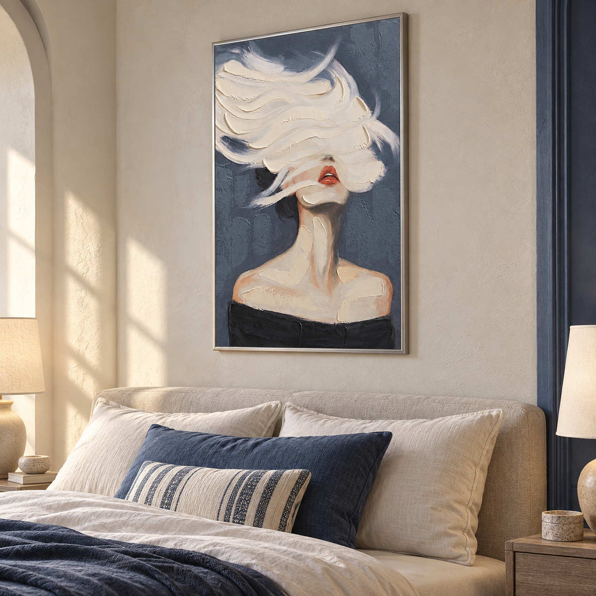 Dreamlike portrait over a beige headboard with navy cushions and bedding.