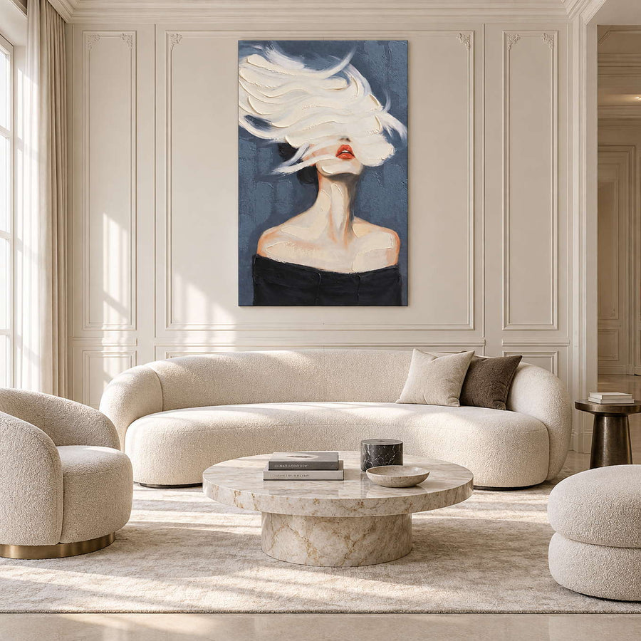 White-swept portrait above a curved cream sofa in a paneled living room.