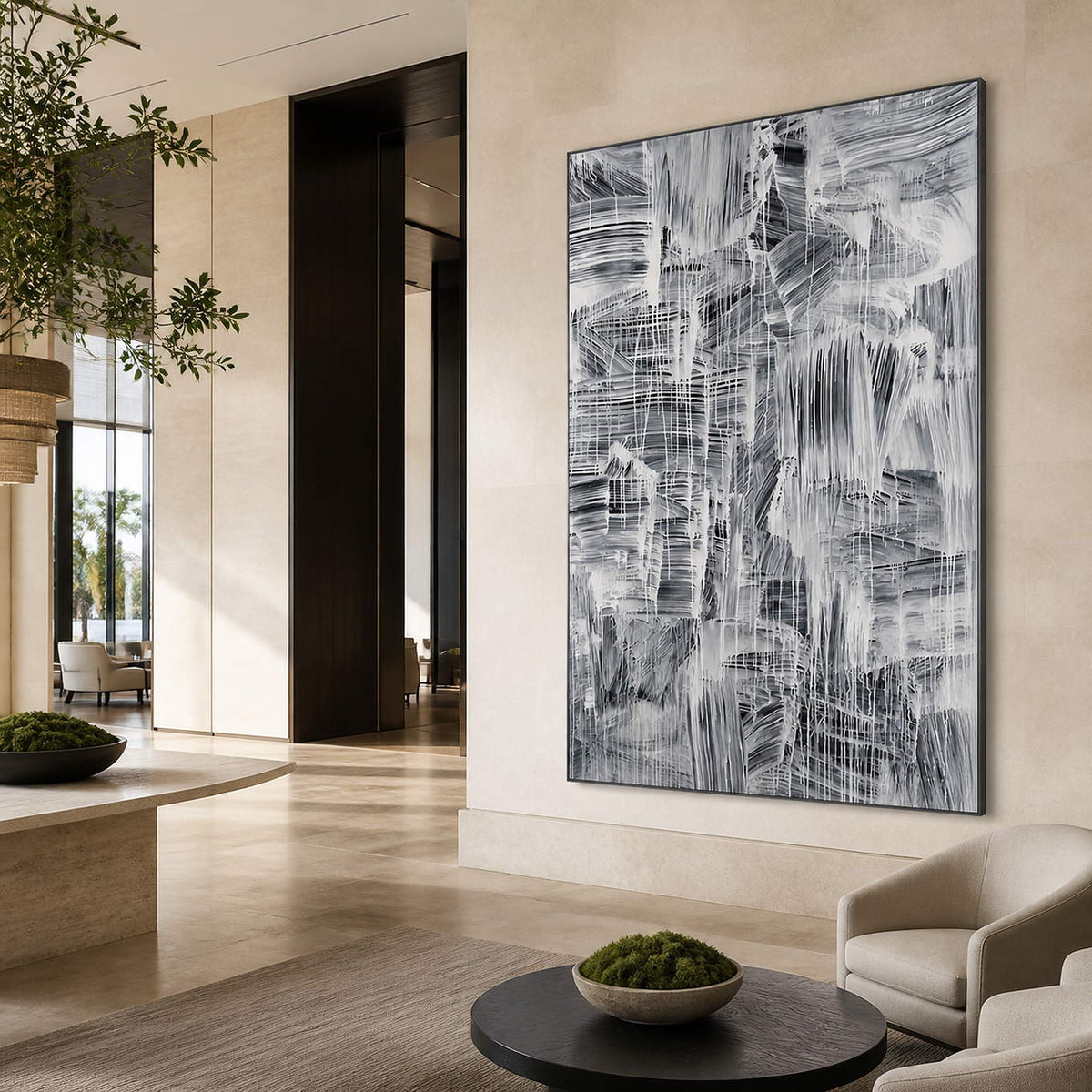 Vertical abstract painting in a lounge with pale walls and a dark round table.