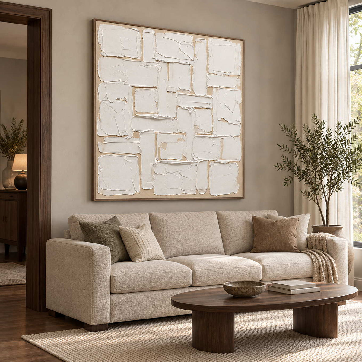 A Patchwork of Light in a brown wood frame above a neutral sofa beside a tall window.