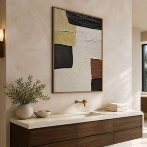 Wood-framed A Pause in the Afternoon above a pale stone vanity with a brass tap in a warm bathroom dry area.