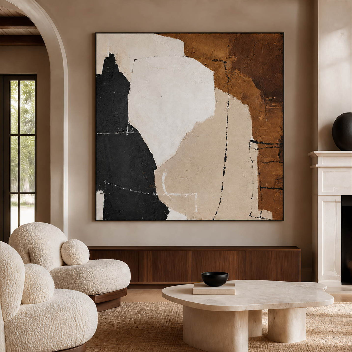 Earth-tone abstract painting beside a fireplace, above low wooden cabinetry and cream seating.