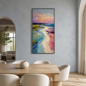 Pastel sunset coastal painting displayed in a light wood dining room.