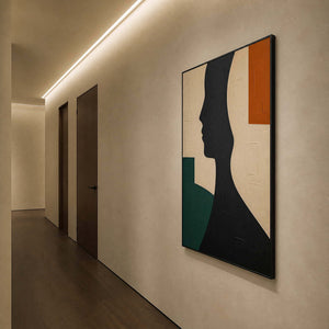 Black and green portrait canvas viewed along a contemporary hallway.