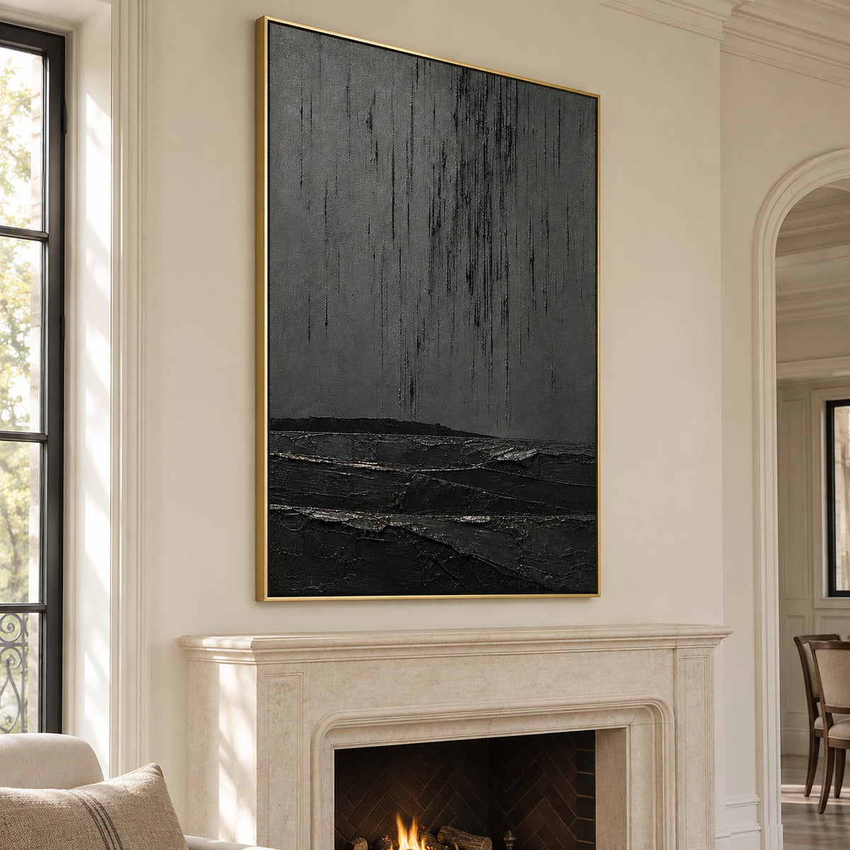 Charcoal rain marks descending over sculpted black terrain in a vertical composition, displayed beside or above a fireplace in a gold frame.