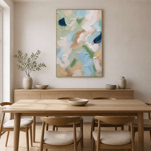 Sage and blue abstract canvas brightens a warm wood dining room.