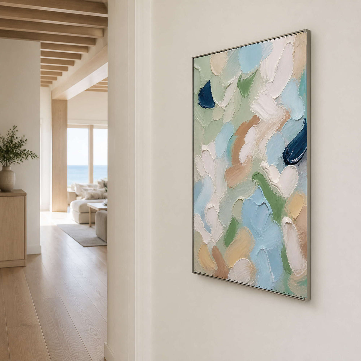 Airy sage abstract canvas brings light color to a modern hallway.