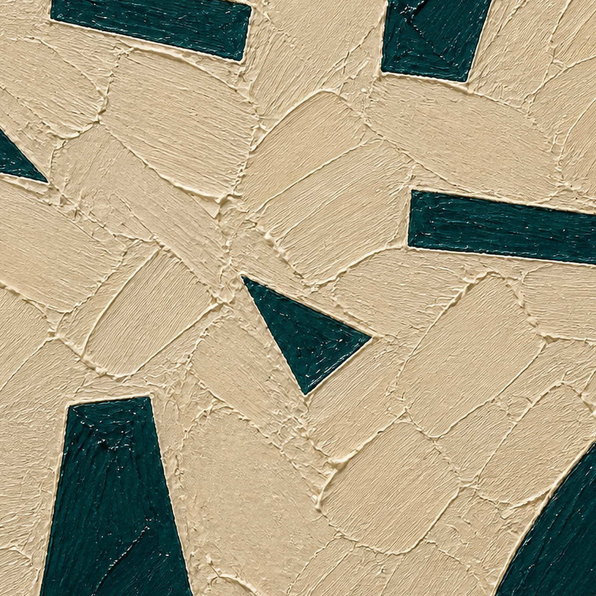 Close-up of raised ivory plaster and deep green geometric texture.