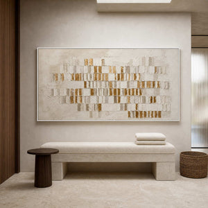 Ivory and gold abstract wall art in a hotel spa dressing area.