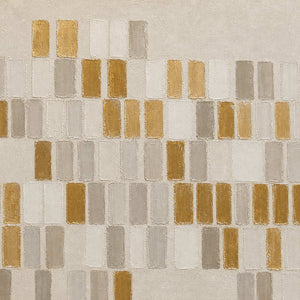 Close-up of raised ivory, gray, and metallic gold rectangular marks.