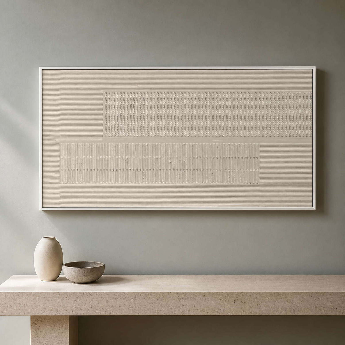 Warm ivory textured artwork above a limestone entryway console.
