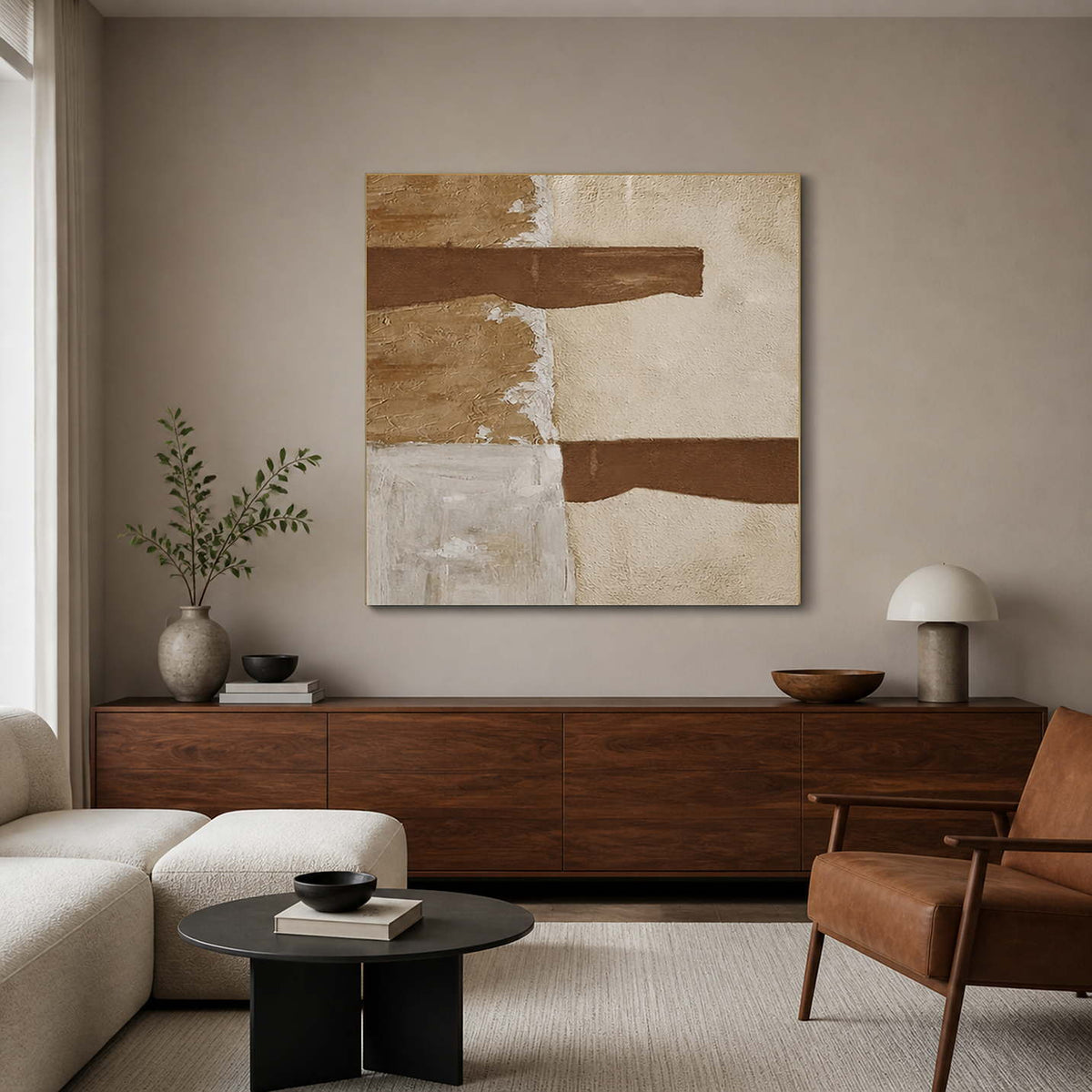 Frameless square abstract painting with two brown strokes above a wooden living room console.