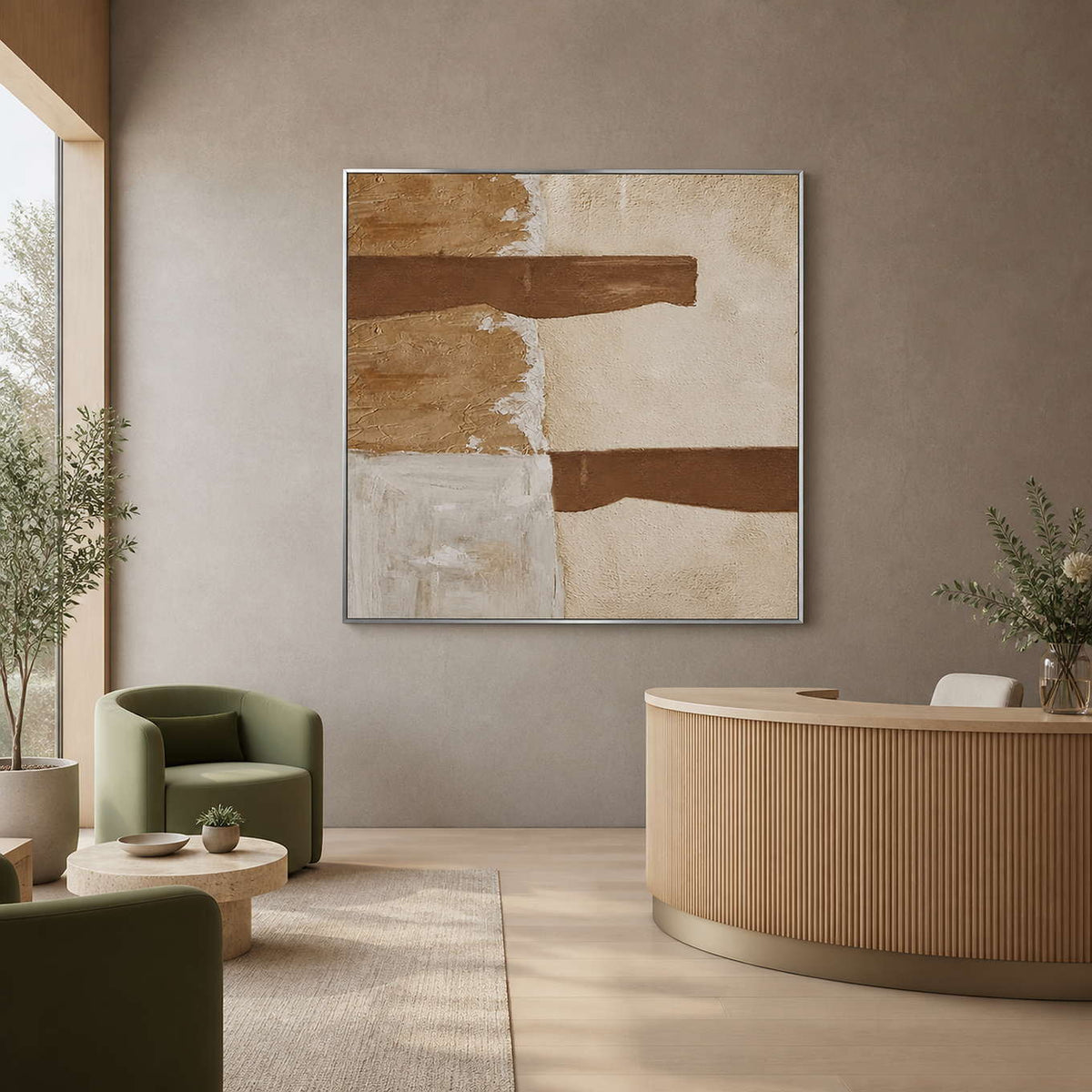 Silver framed cream and ochre abstract painting beside a curved wellness reception desk.