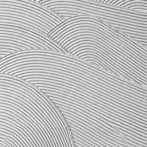 Close view of fine parallel grooves forming overlapping waves in white texture.