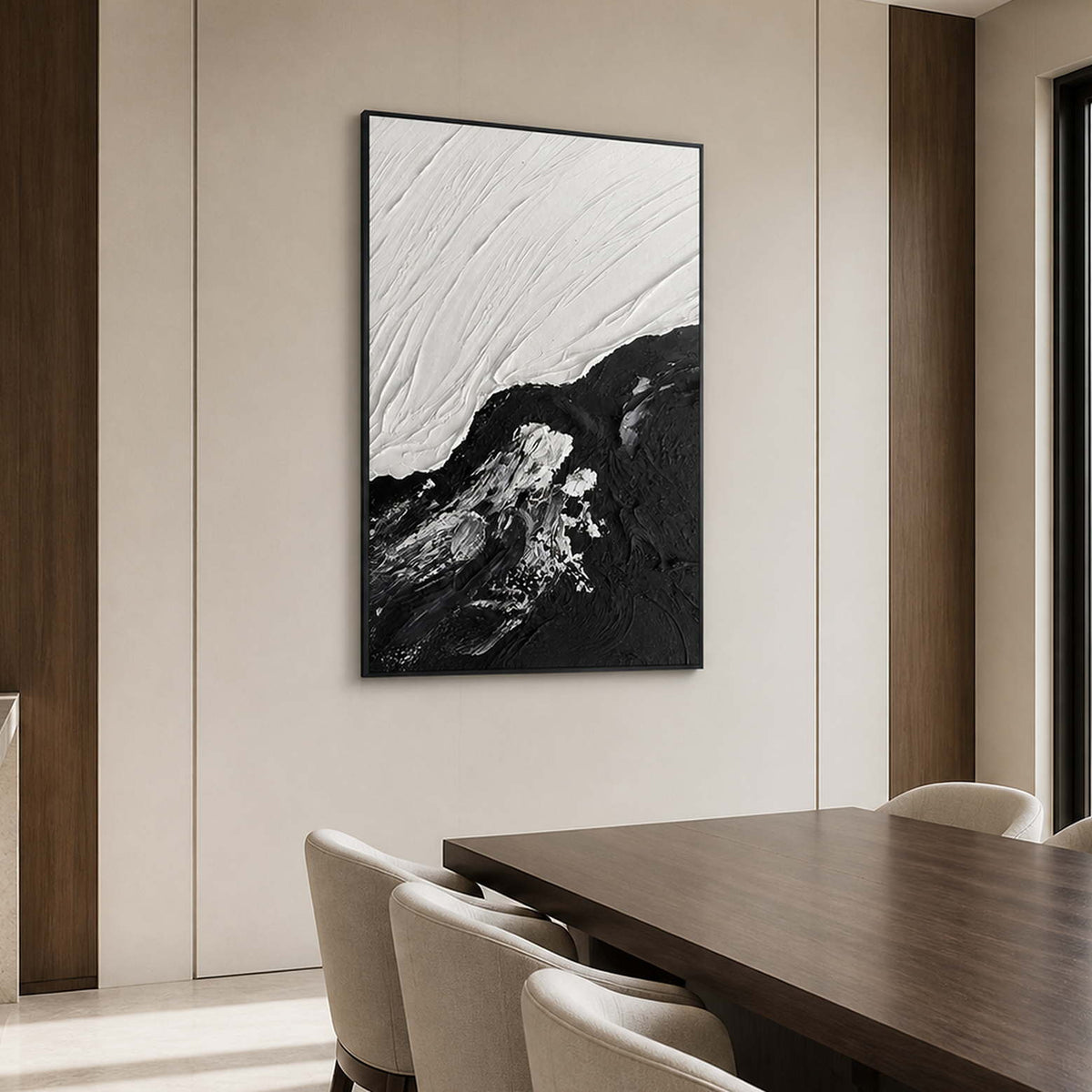 Black framed tidal abstraction beside a walnut dining table and cream upholstered chairs.