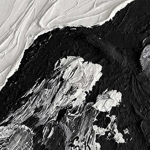 Close detail of white paint fragments over thick black ridges beneath pale diagonal texture.
