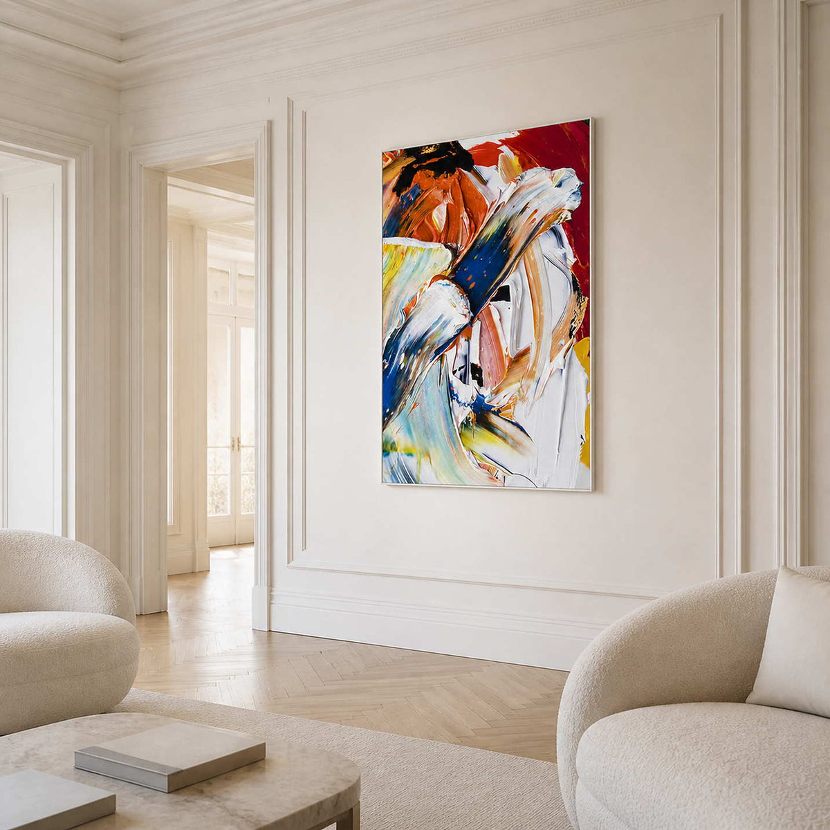 White-framed abstract painting with sweeping blue, white, and orange strokes in a bright formal living room.