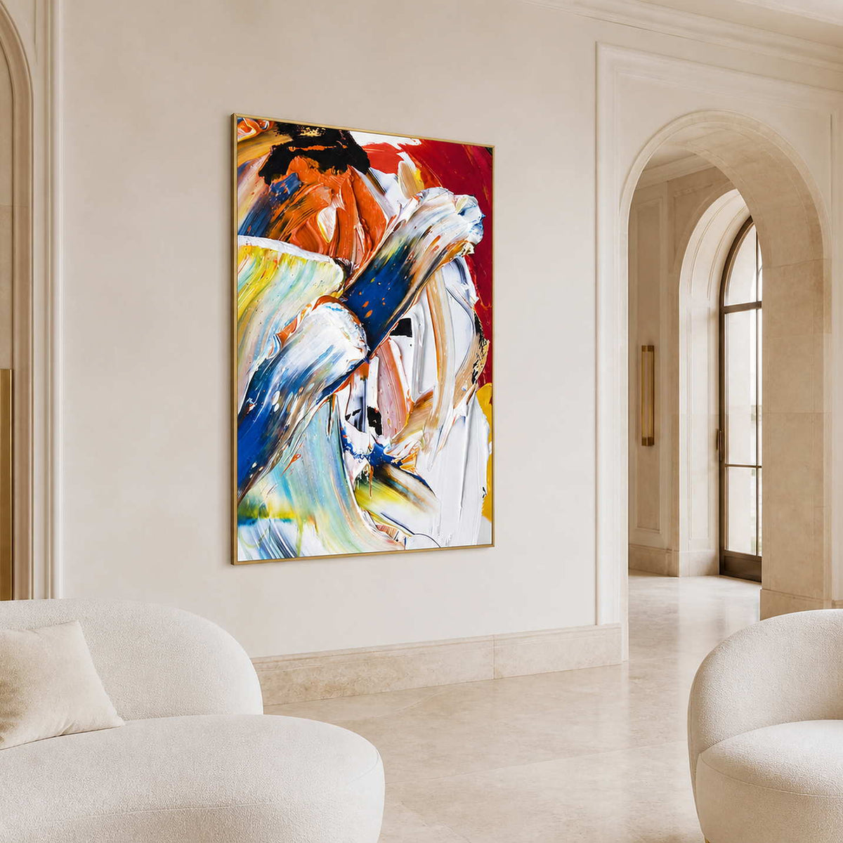 Gold-framed sweeping abstract artwork beside an arched doorway in a warm stone reception lounge.