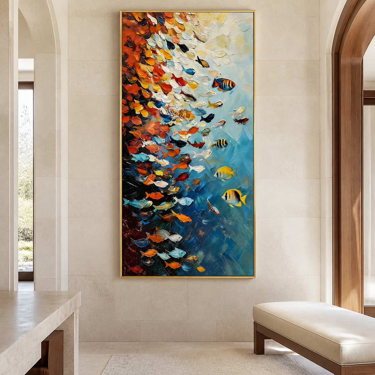 Gold framed colorful fish painting beside an upholstered bench in a stone entrance hall.