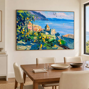 Blue bay artwork beside a wooden dining table and cream chairs.