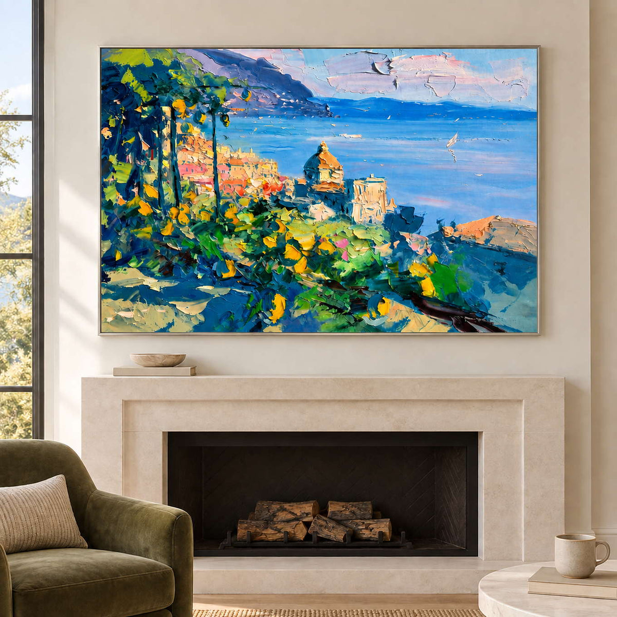 Coastal landscape above a pale fireplace beside a green armchair.