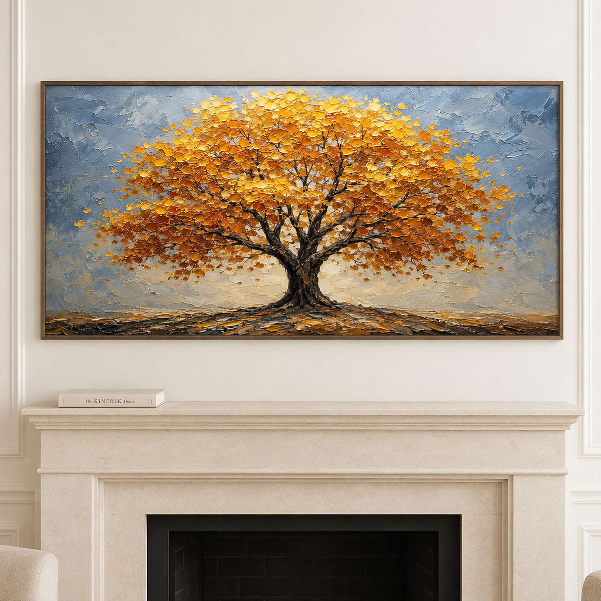 A broad golden autumn tree beneath a gray-blue sky in a brown wood frame, displayed above a fireplace.