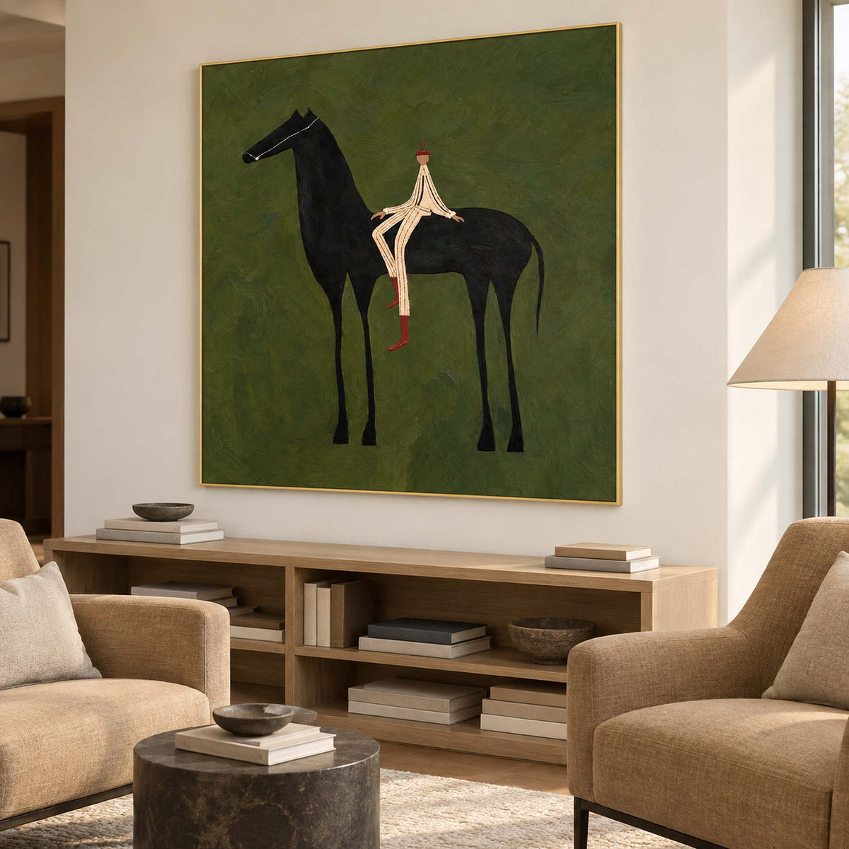 Green rider artwork above open shelving between tan lounge chairs.