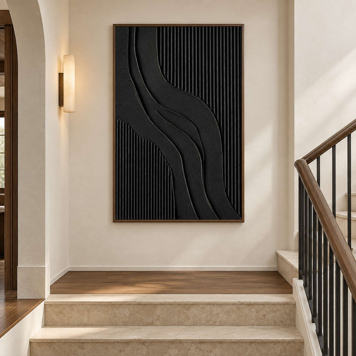 Black ridged abstract on a stair landing beside a wooden handrail.