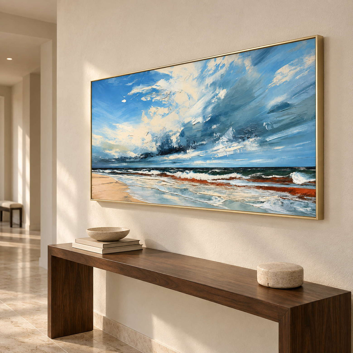 Wide sea-and-cloud artwork above a dark wooden hallway console.