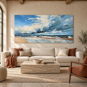 Expansive sky seascape above a cream sofa with rust cushions and a pale rectangular table.