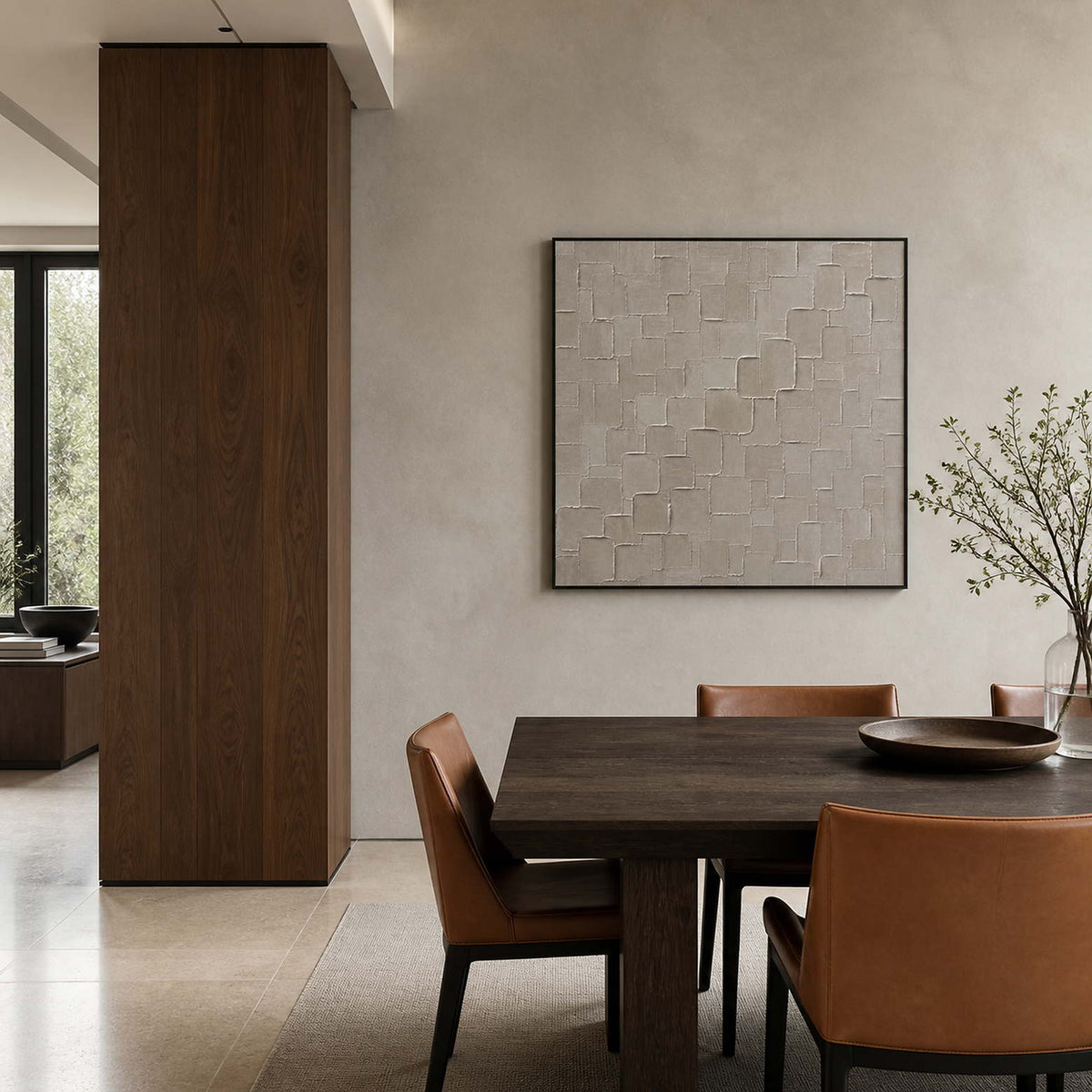 Neutral relief artwork displayed in a mineral-gray walnut dining room.