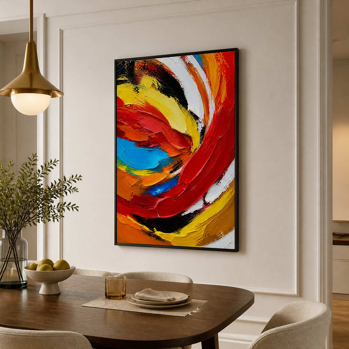 Black framed colorful abstract painting above a rounded wooden dining table.